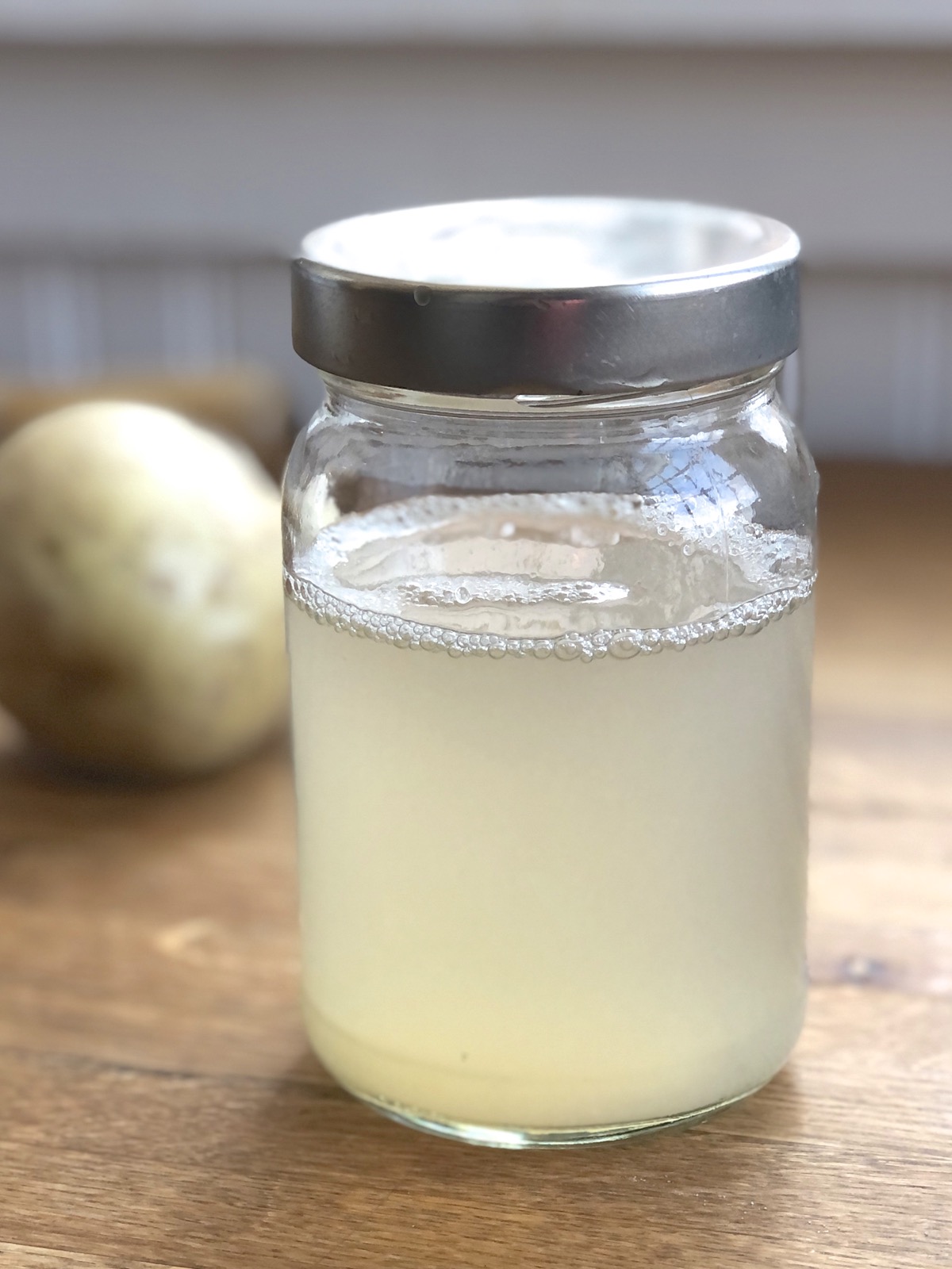 Jar of water left over from boiling potatoes.