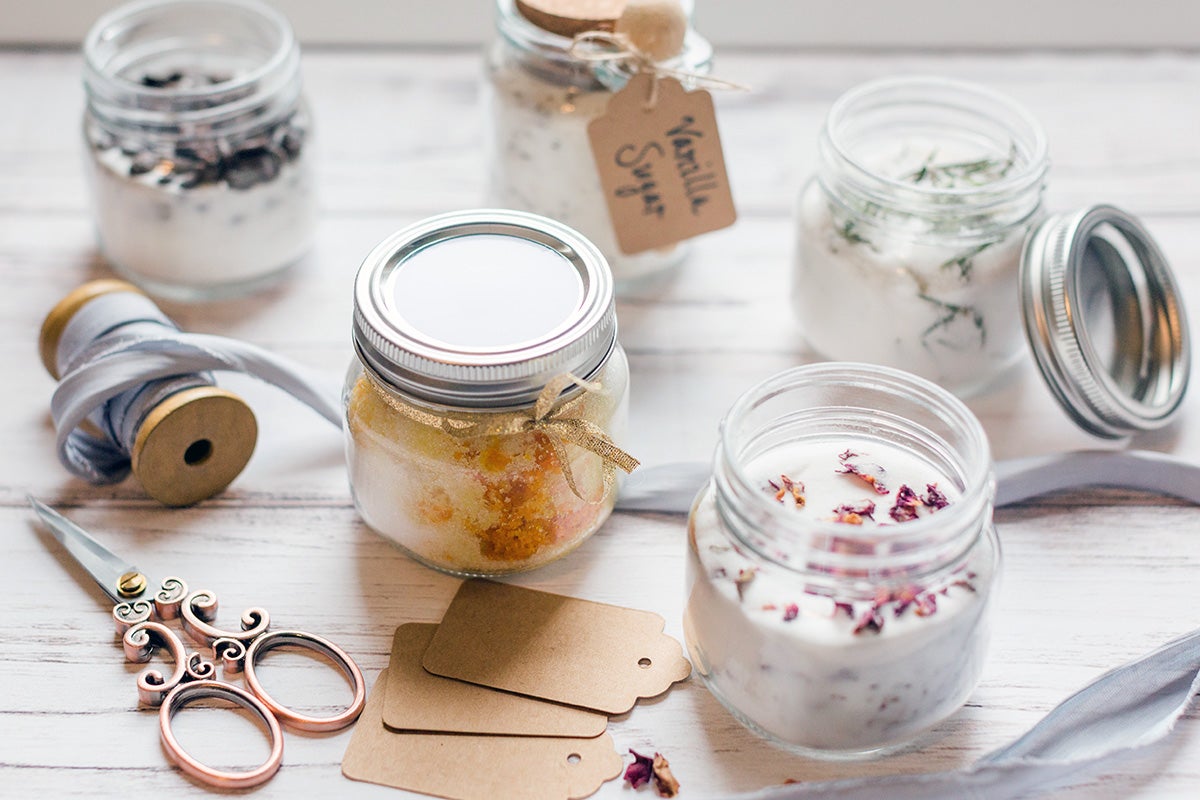 Jars of infused sugar wrapped up for gifting