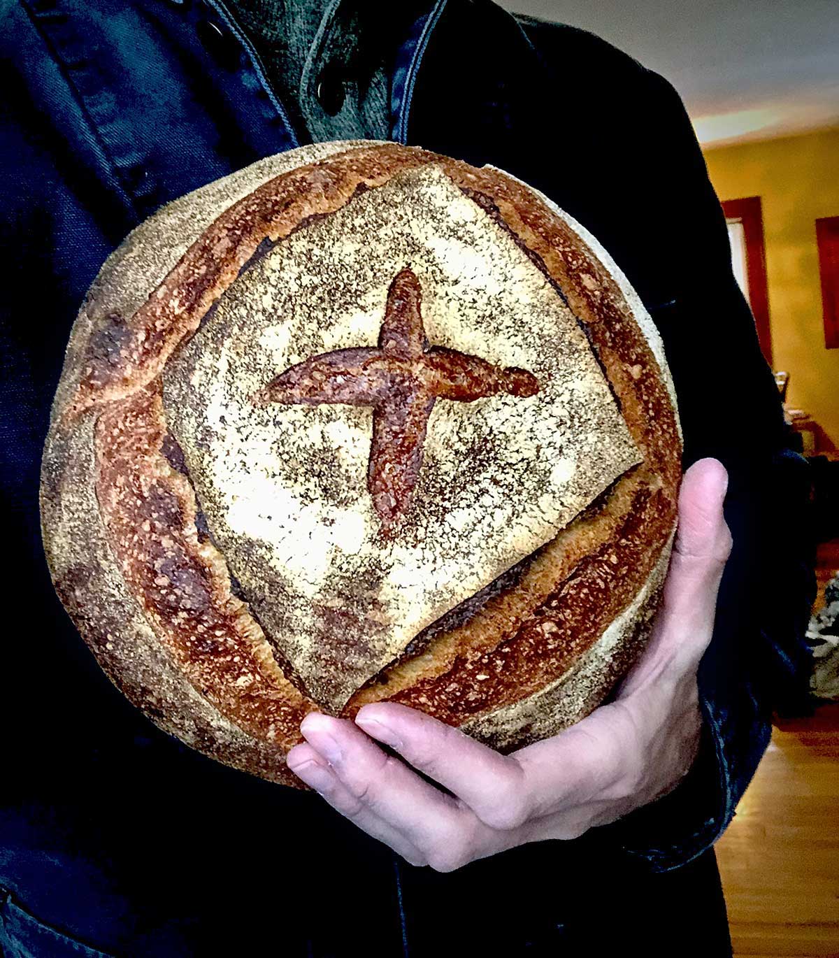 Martin holds his version of Maura's loaf