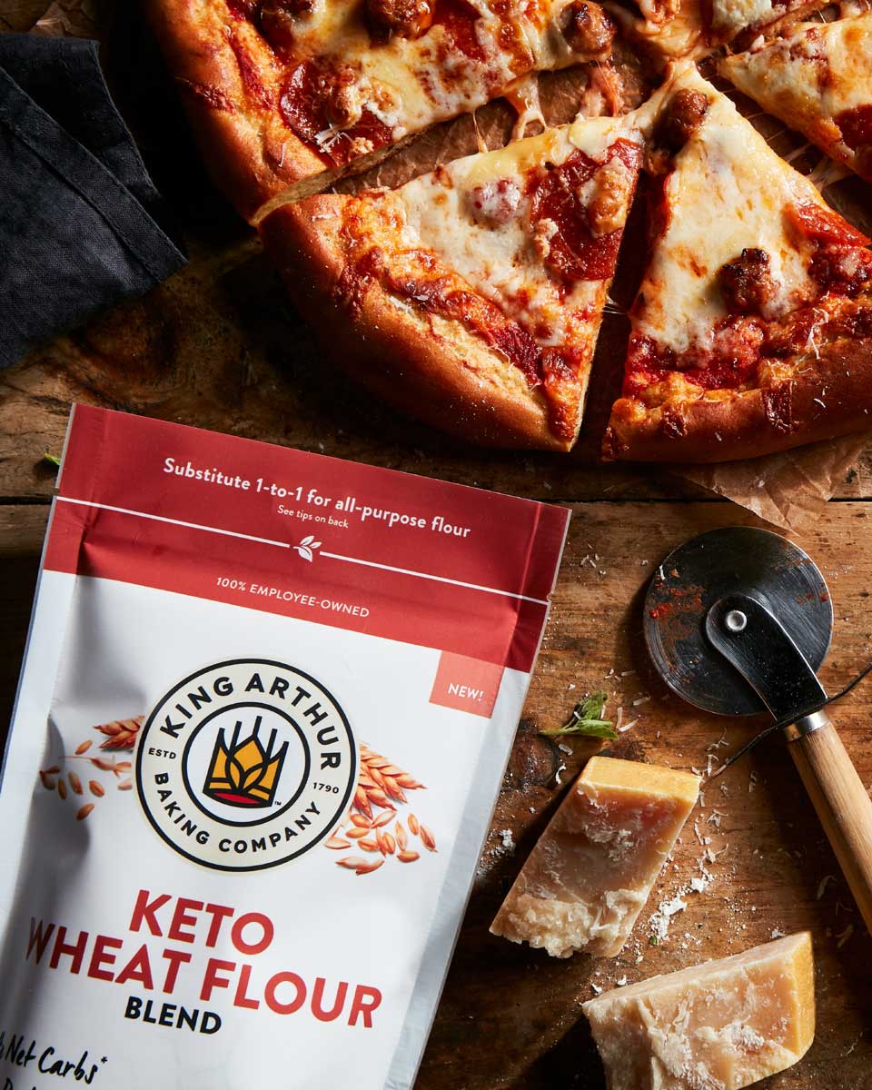 Keto Wheat Flour bag next to keto-friendly pizza