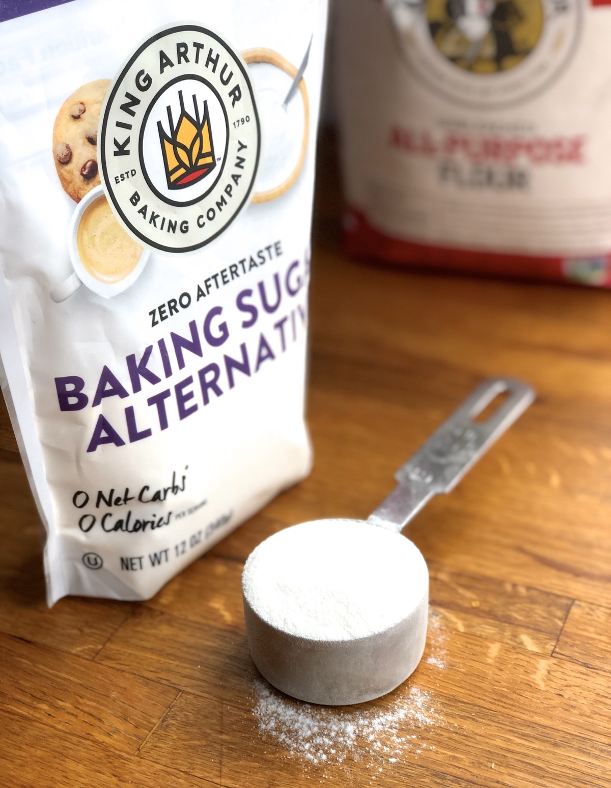 Bag of Baking Sugar Alternative with measuring cup and sugar alternative.