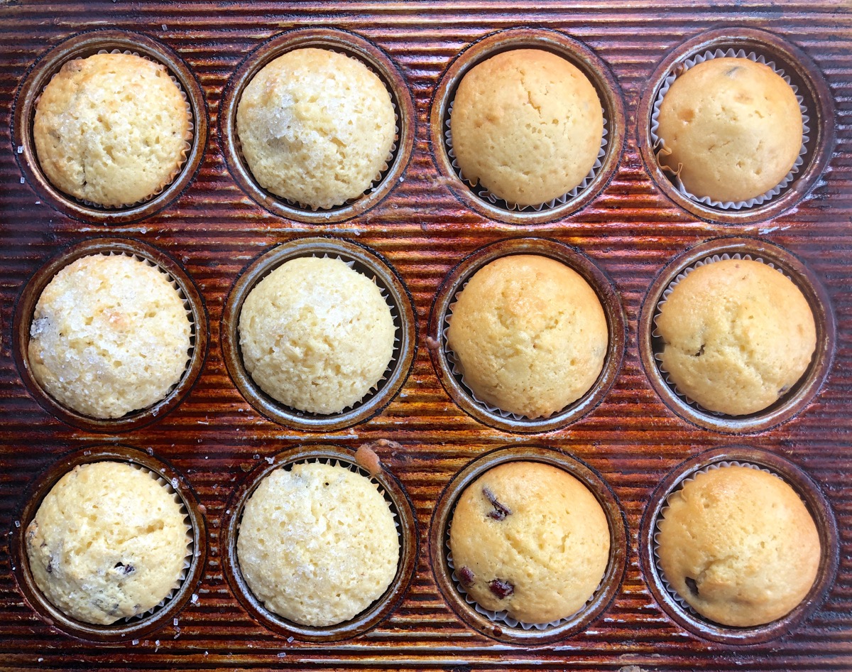 Baked muffins in a pan, half made with Baking Sugar Alternative and more deeply browned.