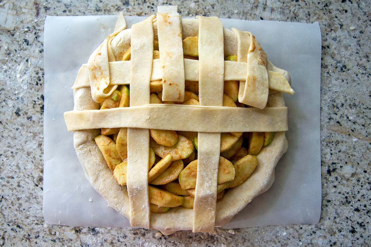 Pie with opposite vertical strips folded back and another horizontal strip added
