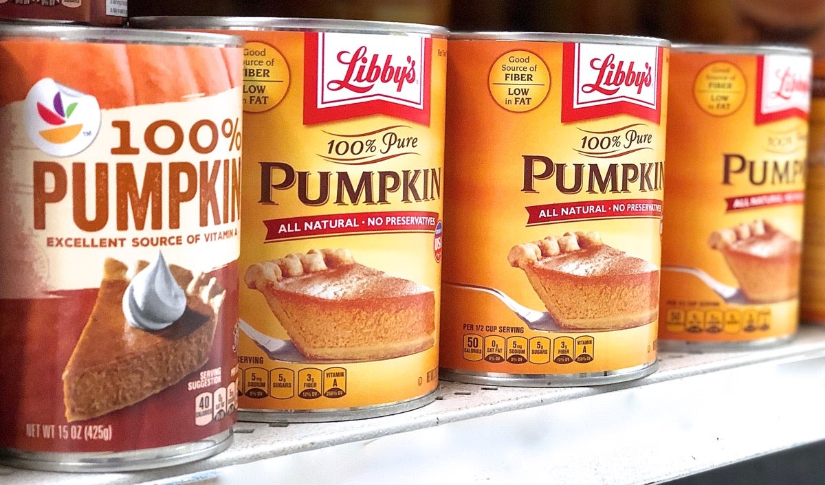 Cans of pumpkin on a supermarket shelf