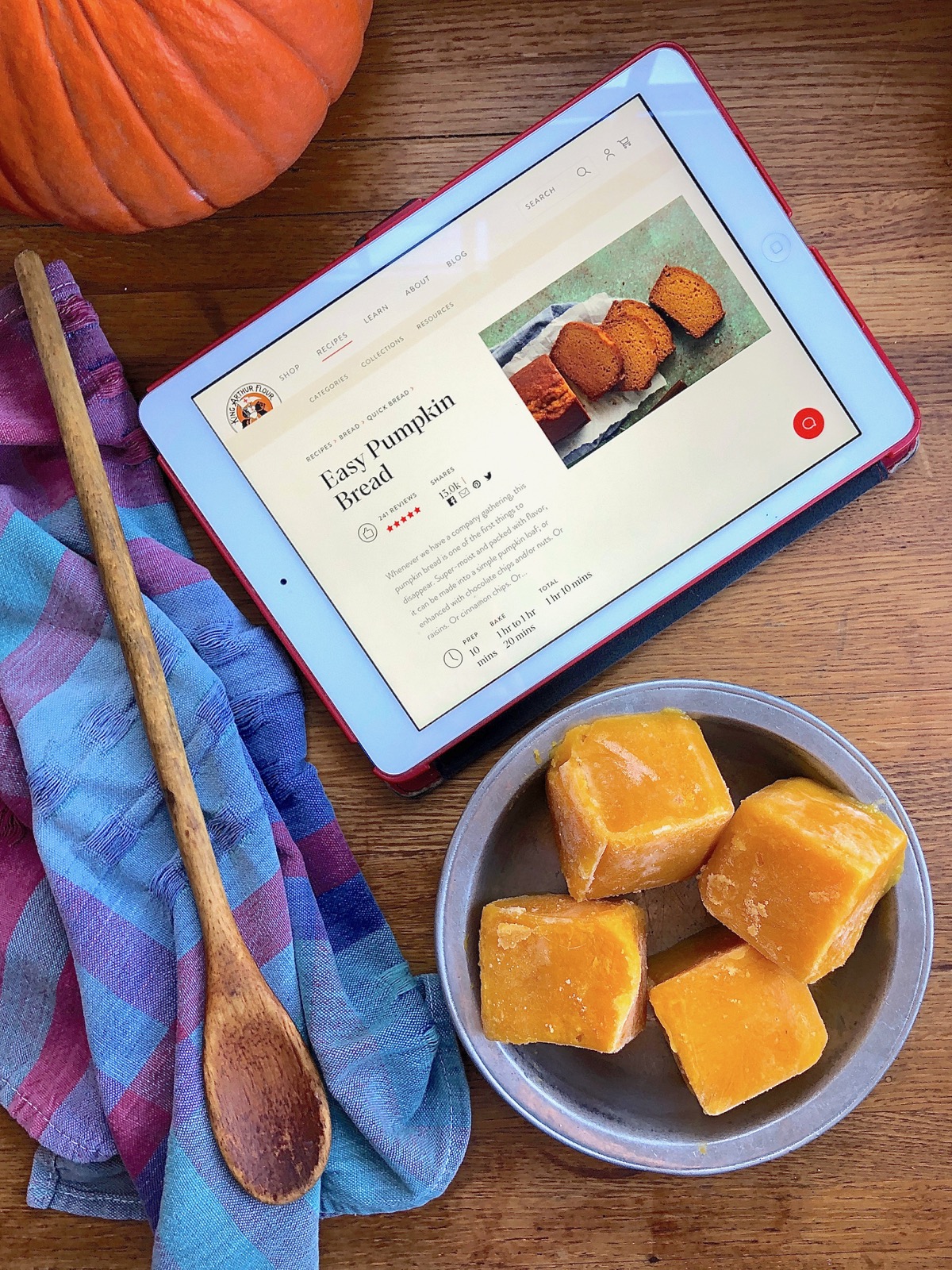 Frozen cubes of pumpkin purée in a bowl waiting to thaw
