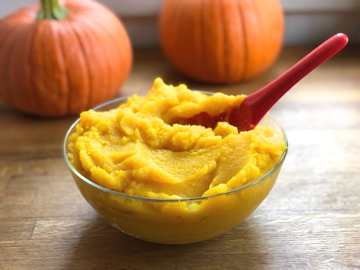 Homemade pumpkin purée in a glass bowl