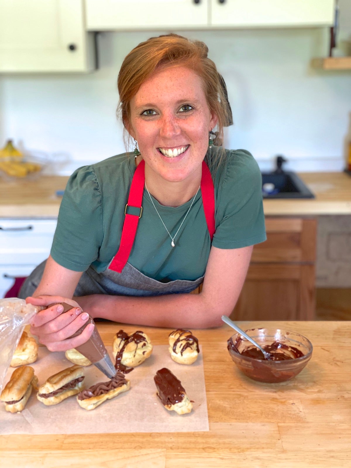 King Arthur baker Kye Ameden showing how to frost eclairs.