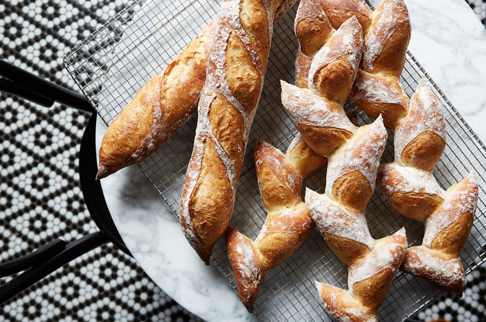 baguettes and epi de ble artisan breads on table