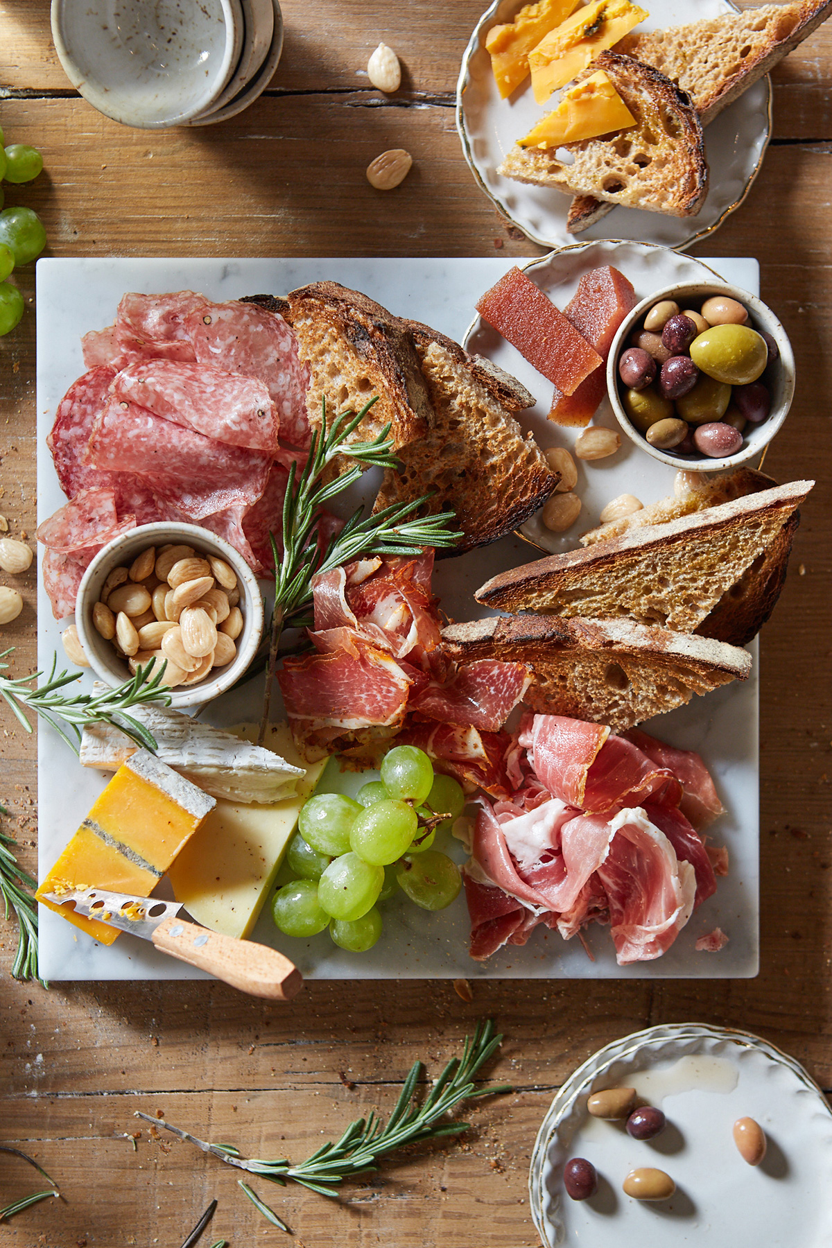 cheese and salumi platter with bread and olives