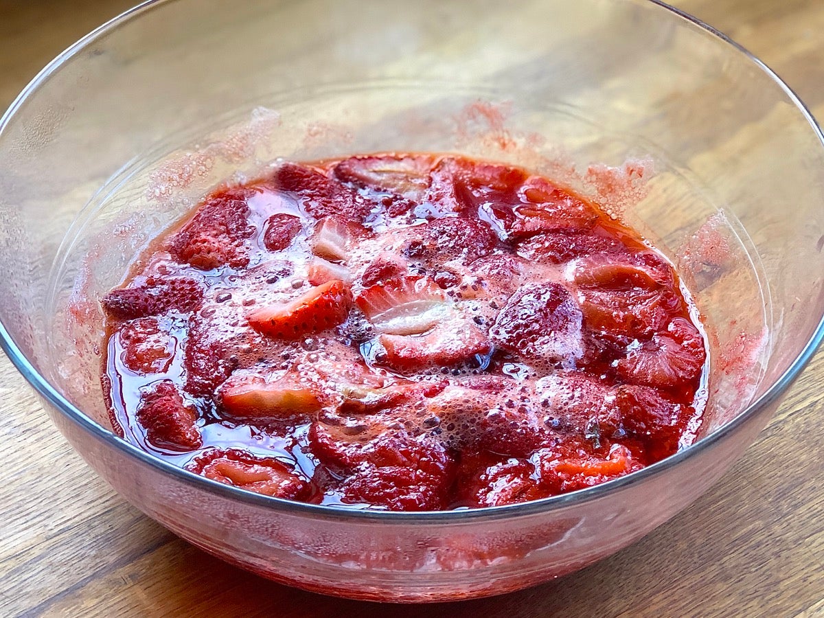 Bowl of cut strawberries and sugar cooke din the microwave for 5 minutes.