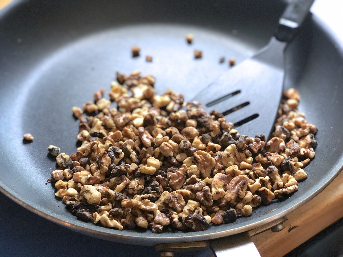 Chopped walnuts dry-fried in a skillet until toasty brown.