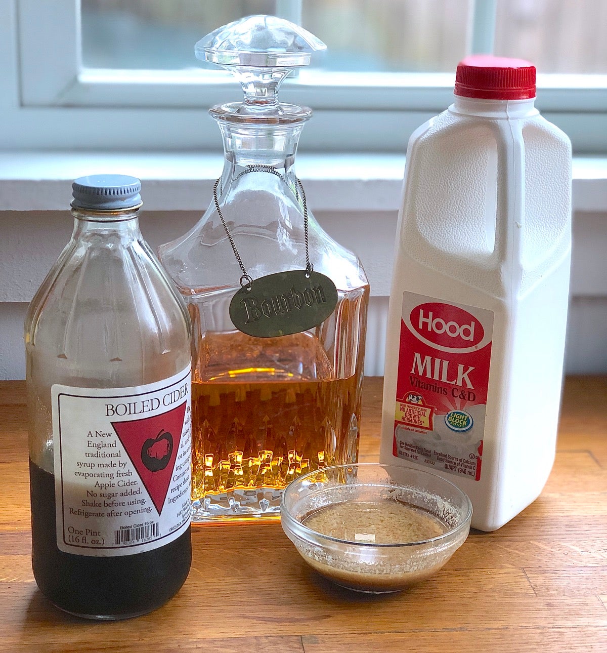 Boiled cider, bourbon, and milk, ready to be added to brown sugar frosting.