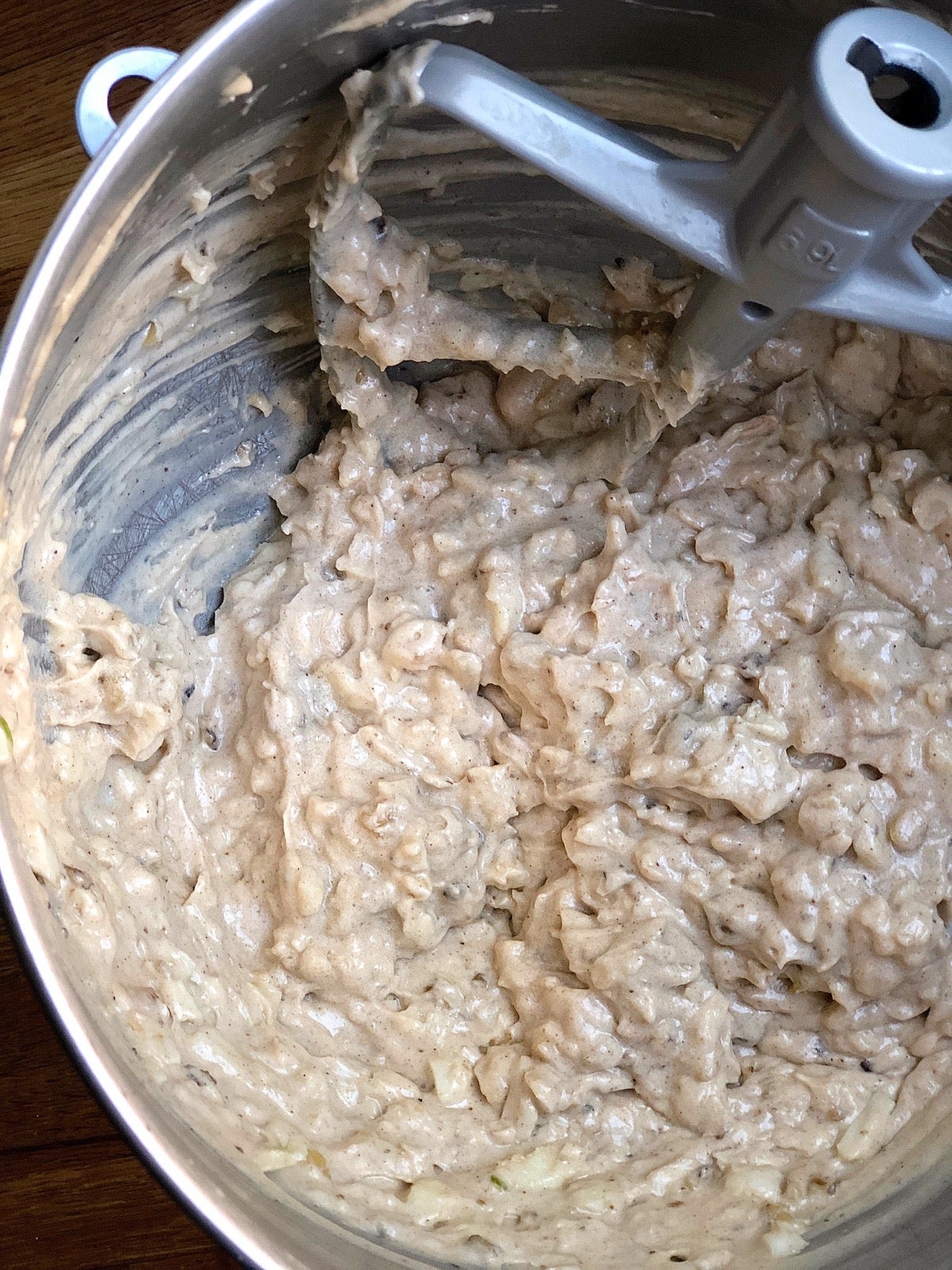 Apple cake batter in a mixing bowl. 