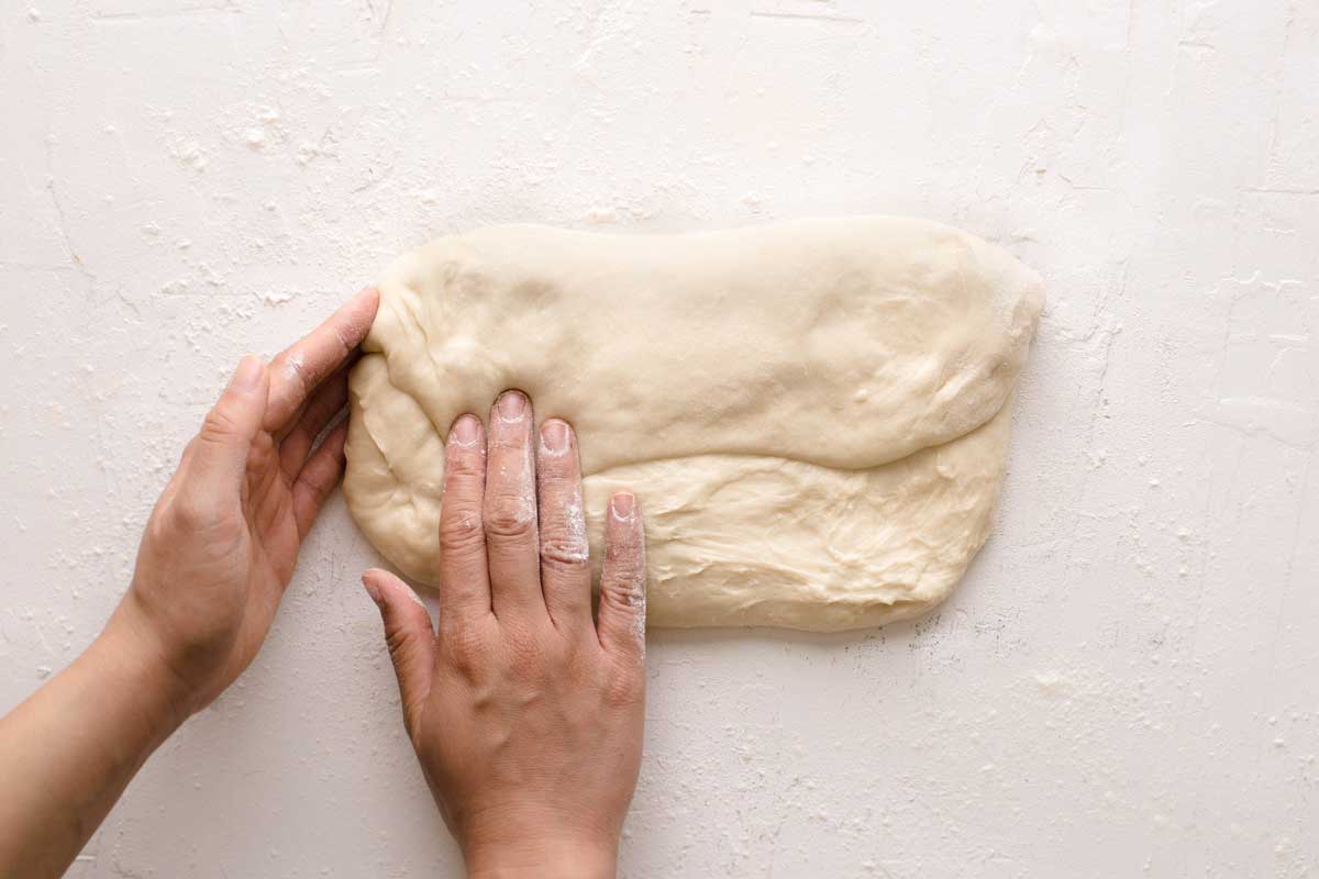 Folding pandesal dough 