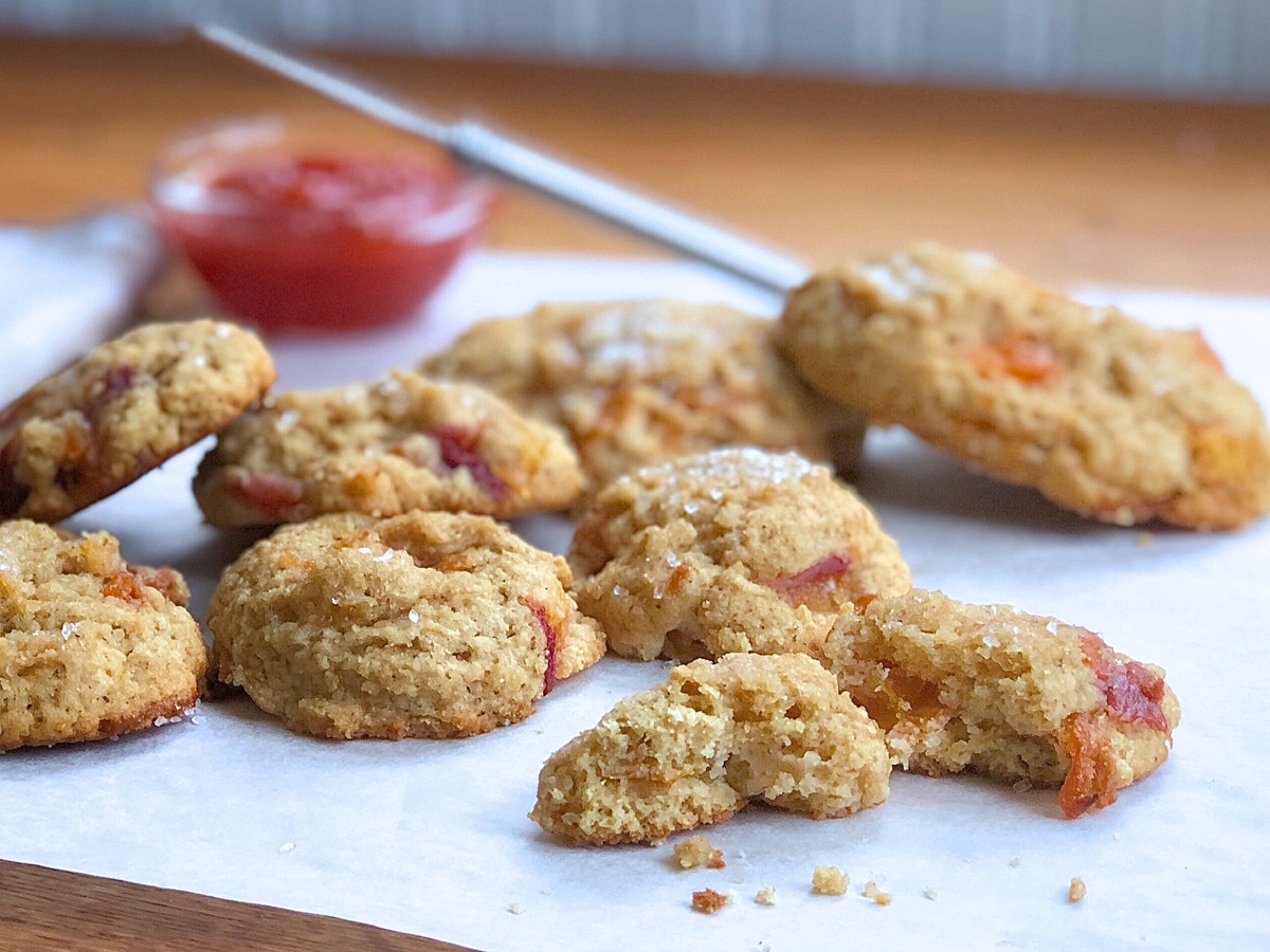 Peach scones made with whole wheat flour on a piece of parchment, ready to plate and serve.