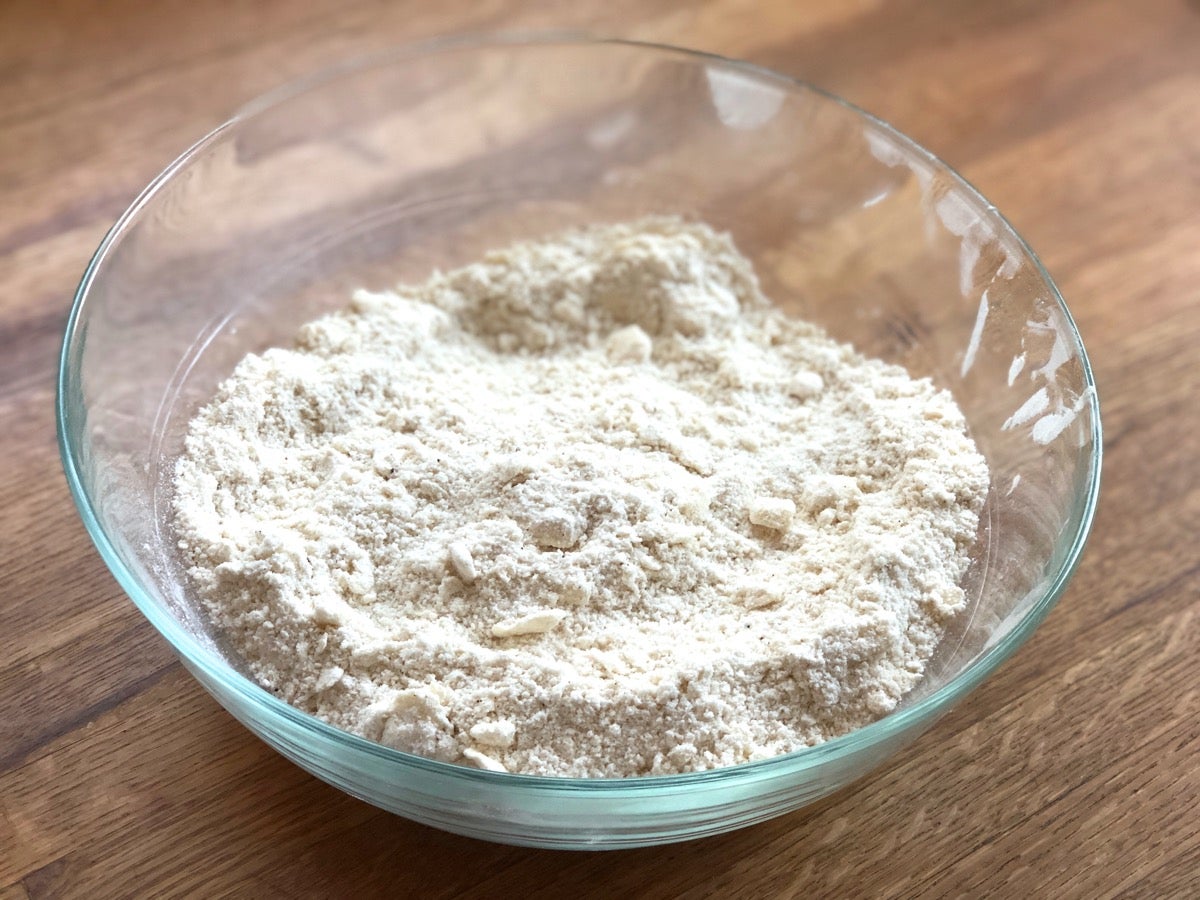 Cold butter worked into a bowl of flour and other dry ingredients to make scones.