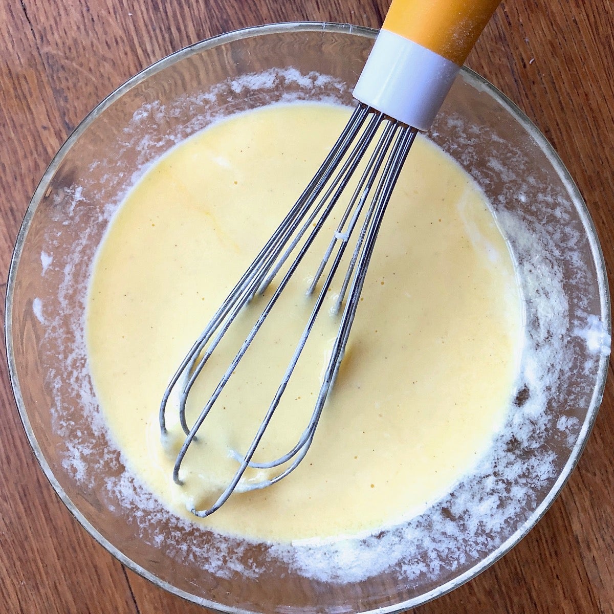 Eggs. yogurt, and almond extract whisked together before being added to the dry ingredients for scones.