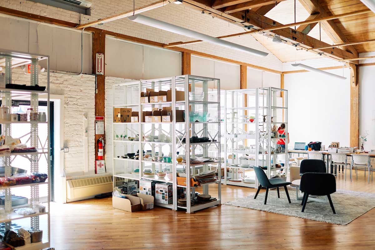 Interior of studio, showing prop shelving and lounge area