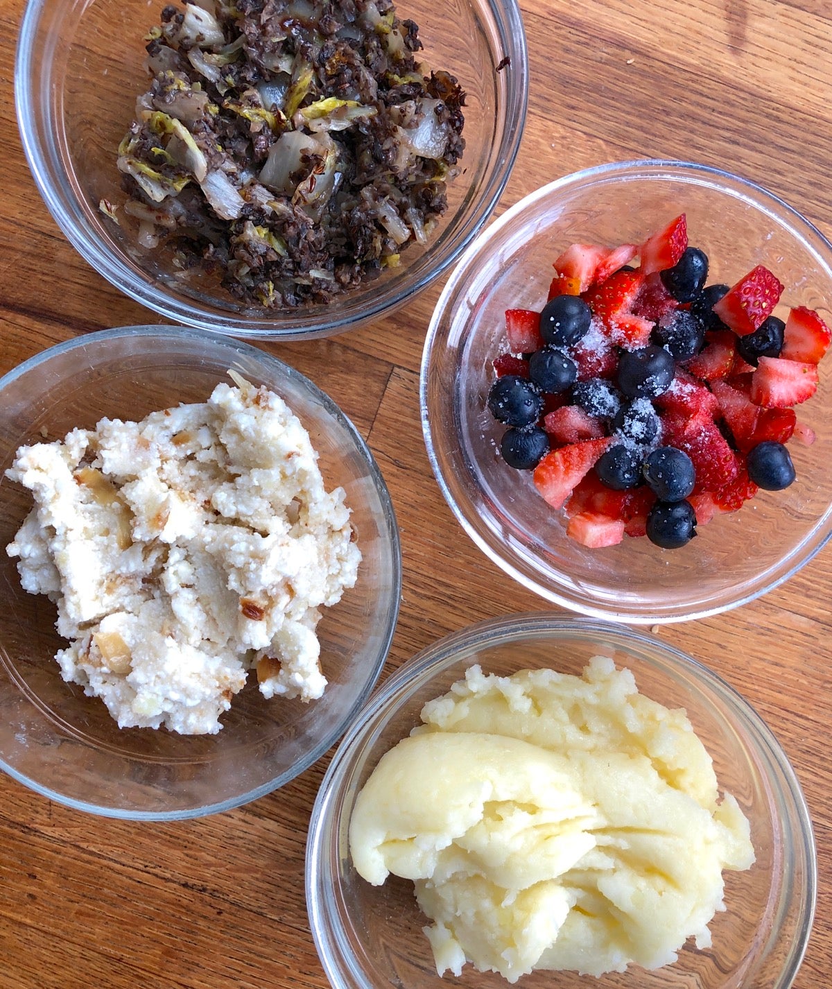 Four pierogi fillings: cabbage and mushroom, potato, onion and farmers' cheese, mixed fresh berry, and mashed potato and cheddar.