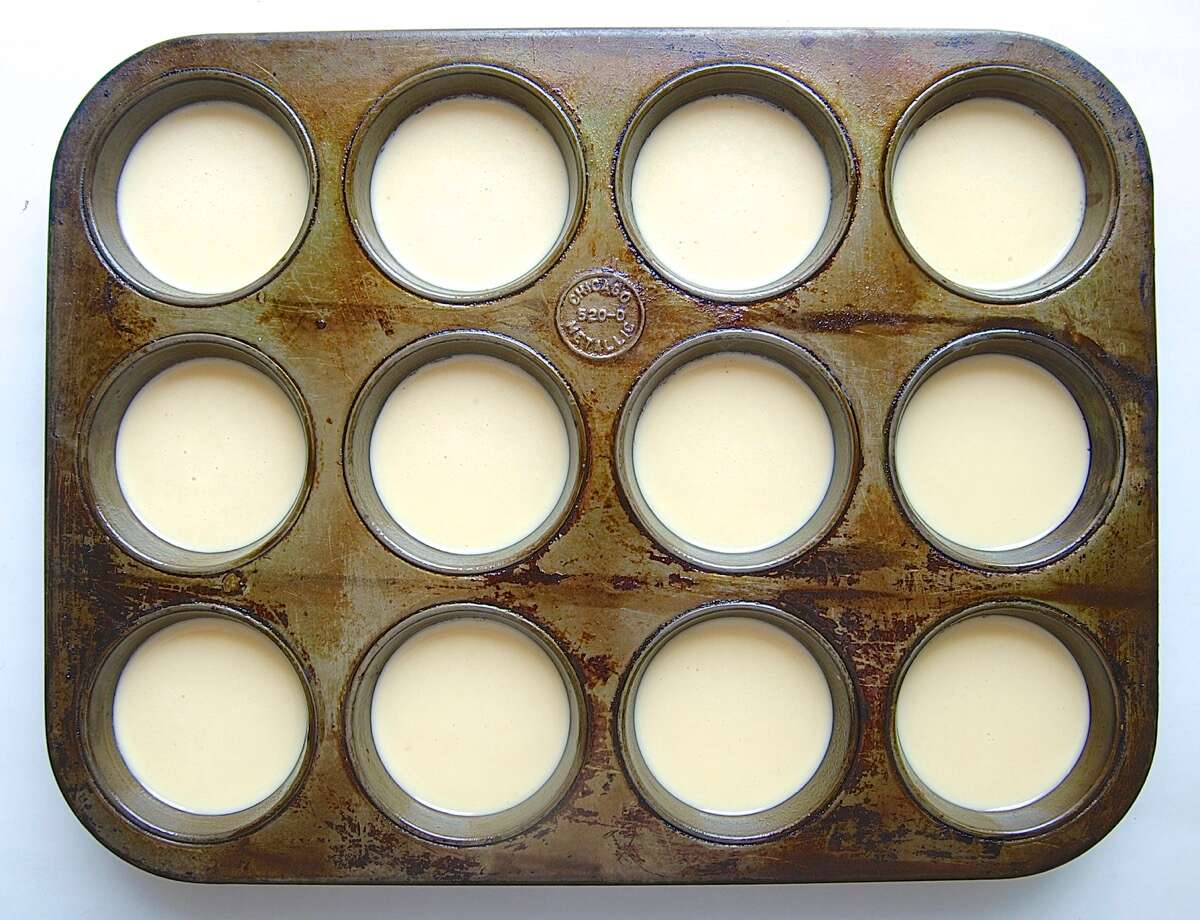 Muffin tin full of popover batter