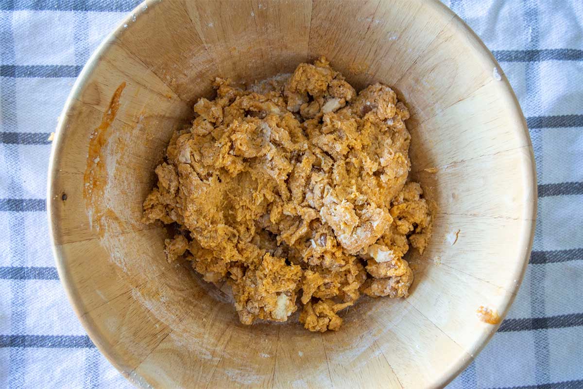 Bowl of shagging mixed scone dough, with small traces of flour