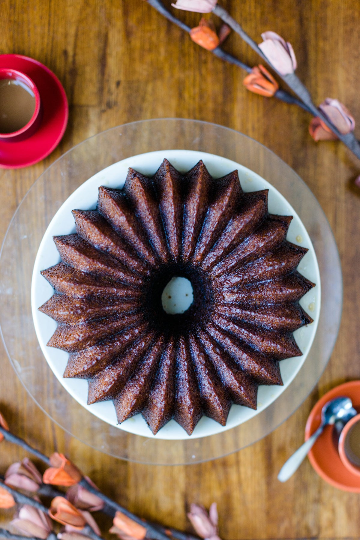 A pumpkin Bundt cake baked in a Brilliant Bundt pan on a cake stand