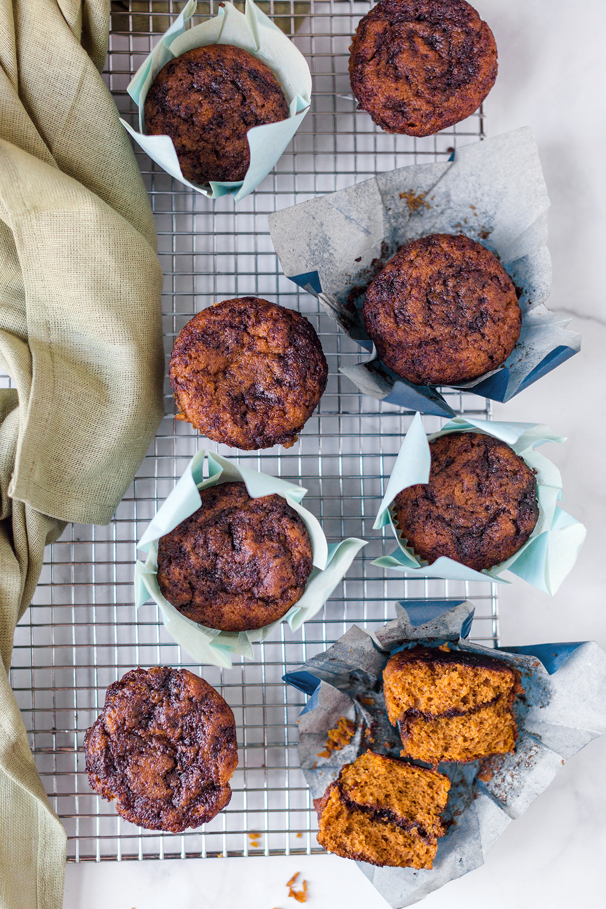 Pumpkin muffins with an espresso swirl on a cooling rack