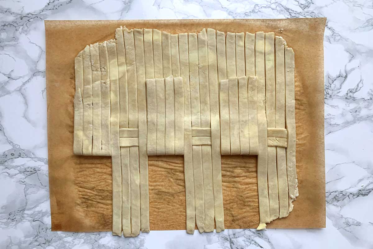 Same dough, with alternating groups of four strips folded back 