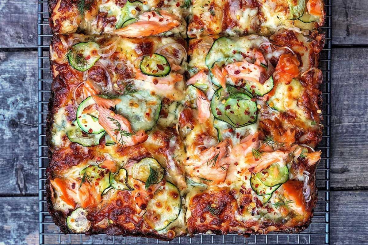 Rectangular pan pizza with smoked salmon and other toppings