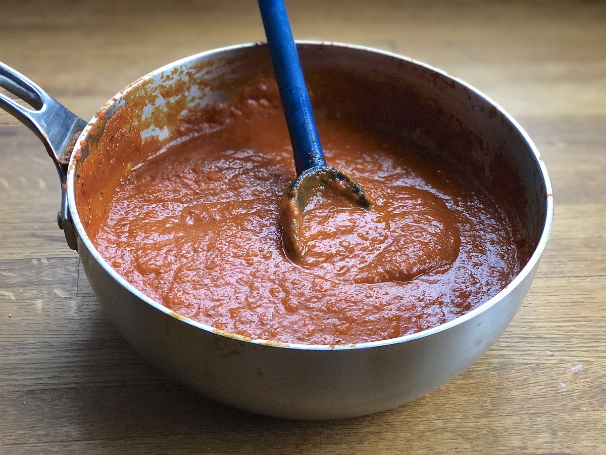 A saucepan of long-simmered tomato sauce.