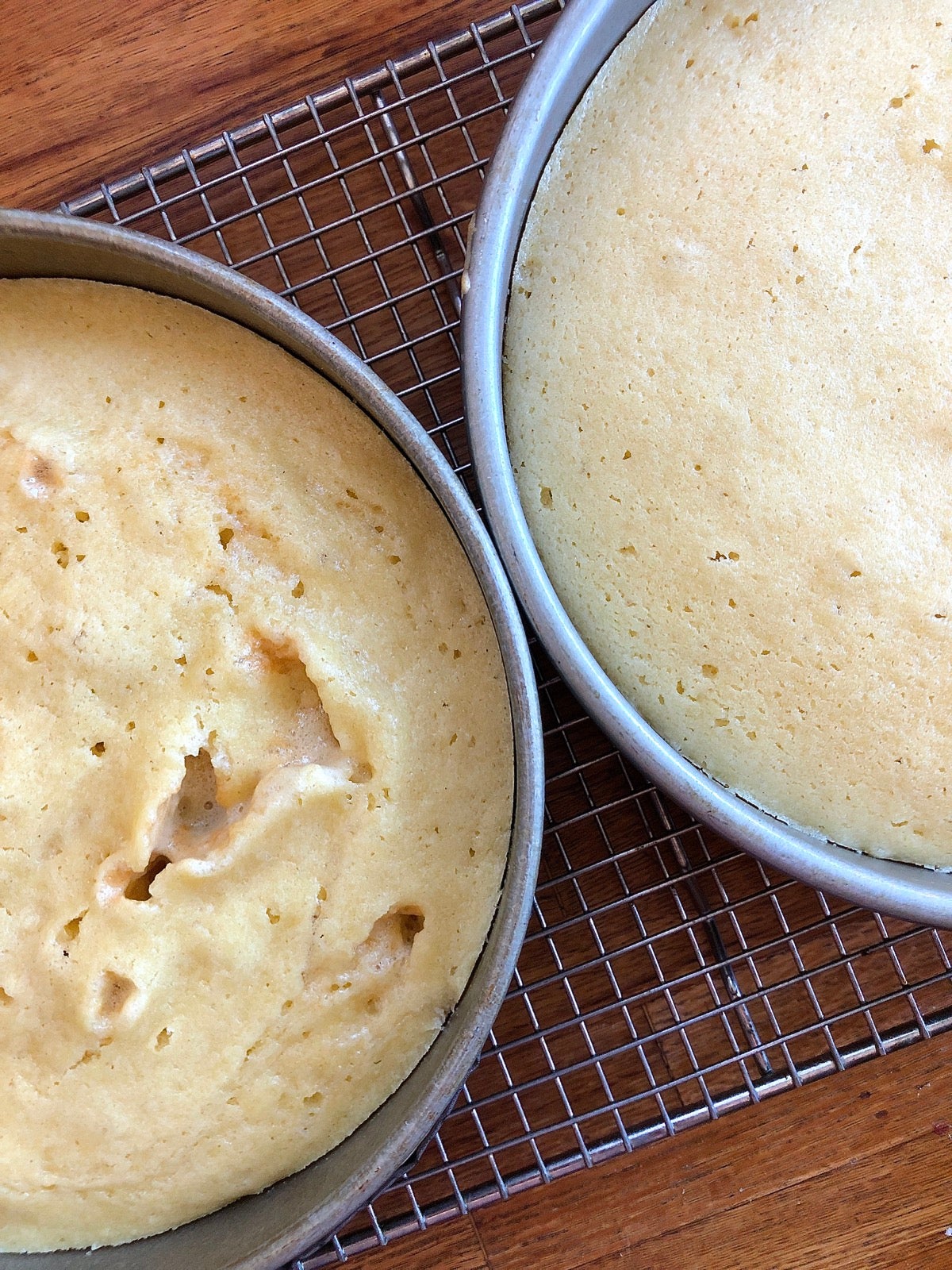 Two round cake layers, one with a hole-riddled, uneven top, one perfectly smooth.