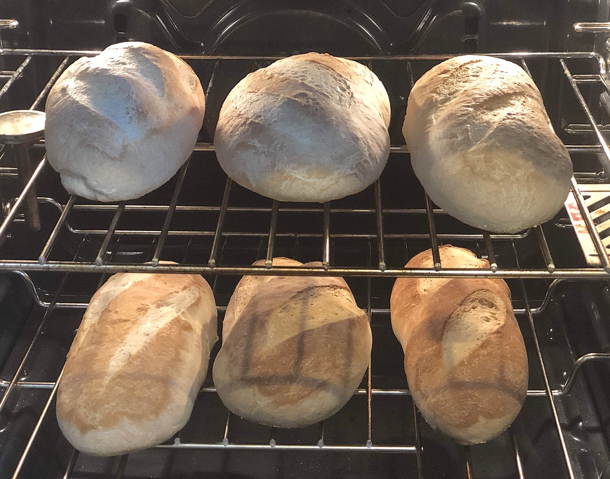 Loaves cooling in the turned-off oven.