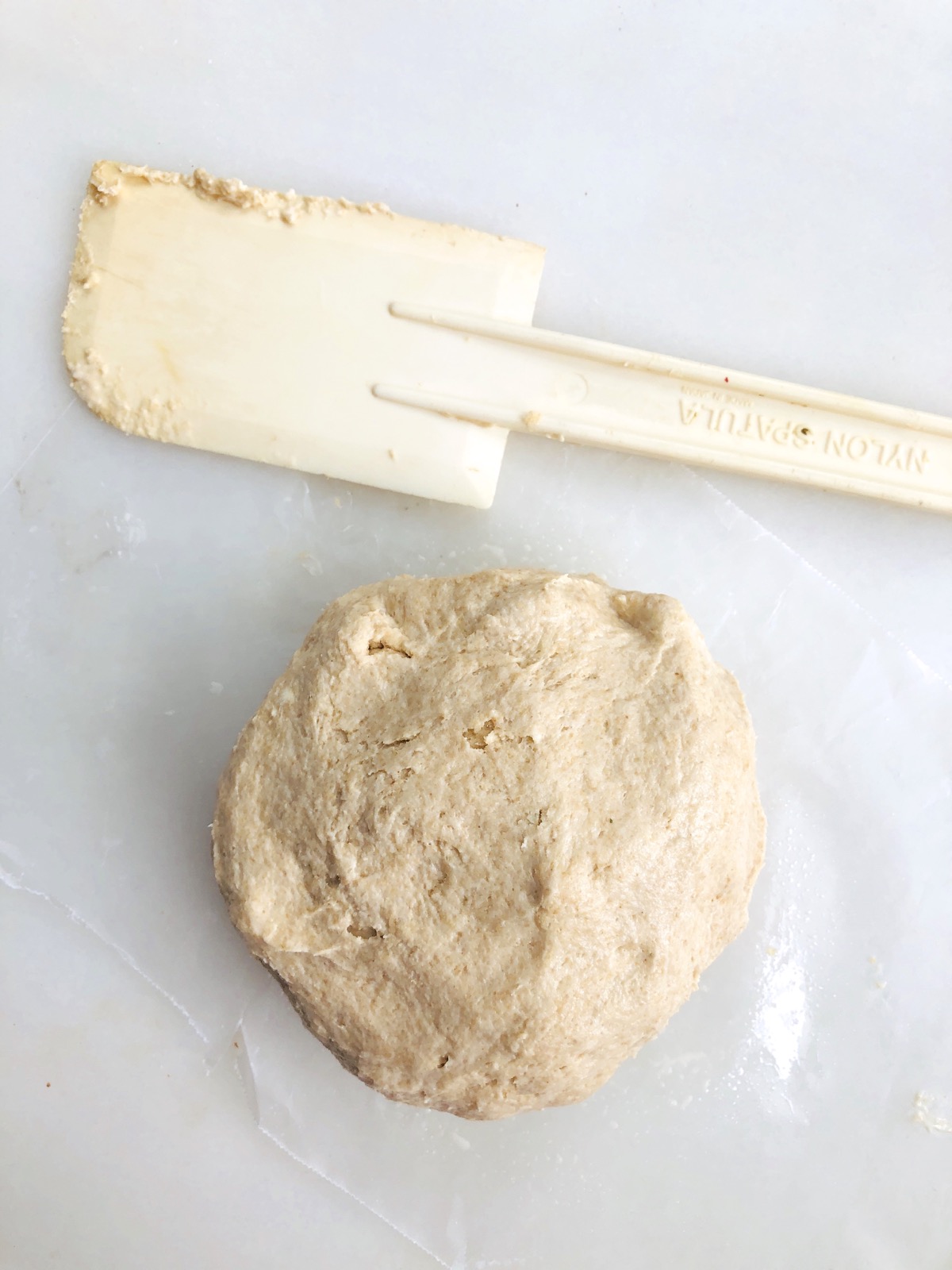 Sourdough cracker dough with spatula