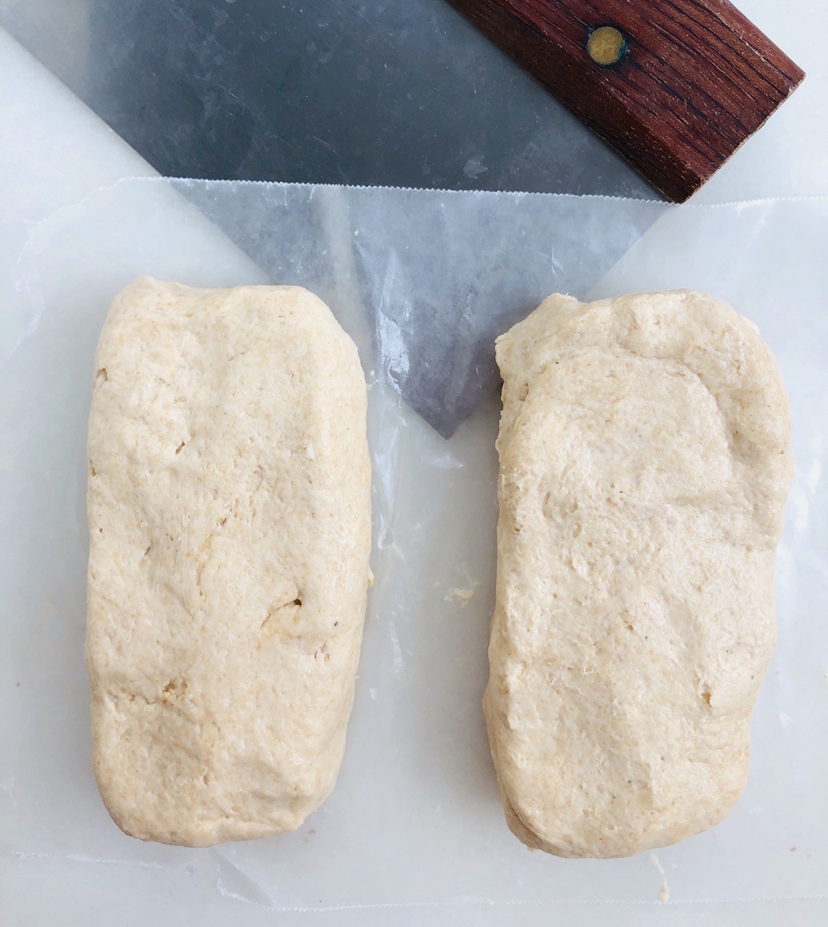 Dough for sourdough crackers cut in half and shaped into rectangles