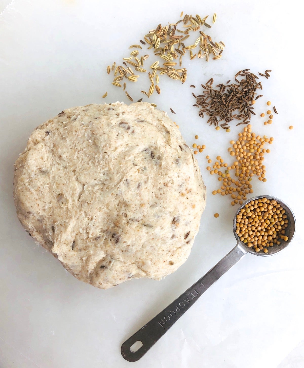 Rye sourdough cracker dough with seeds mixed in.