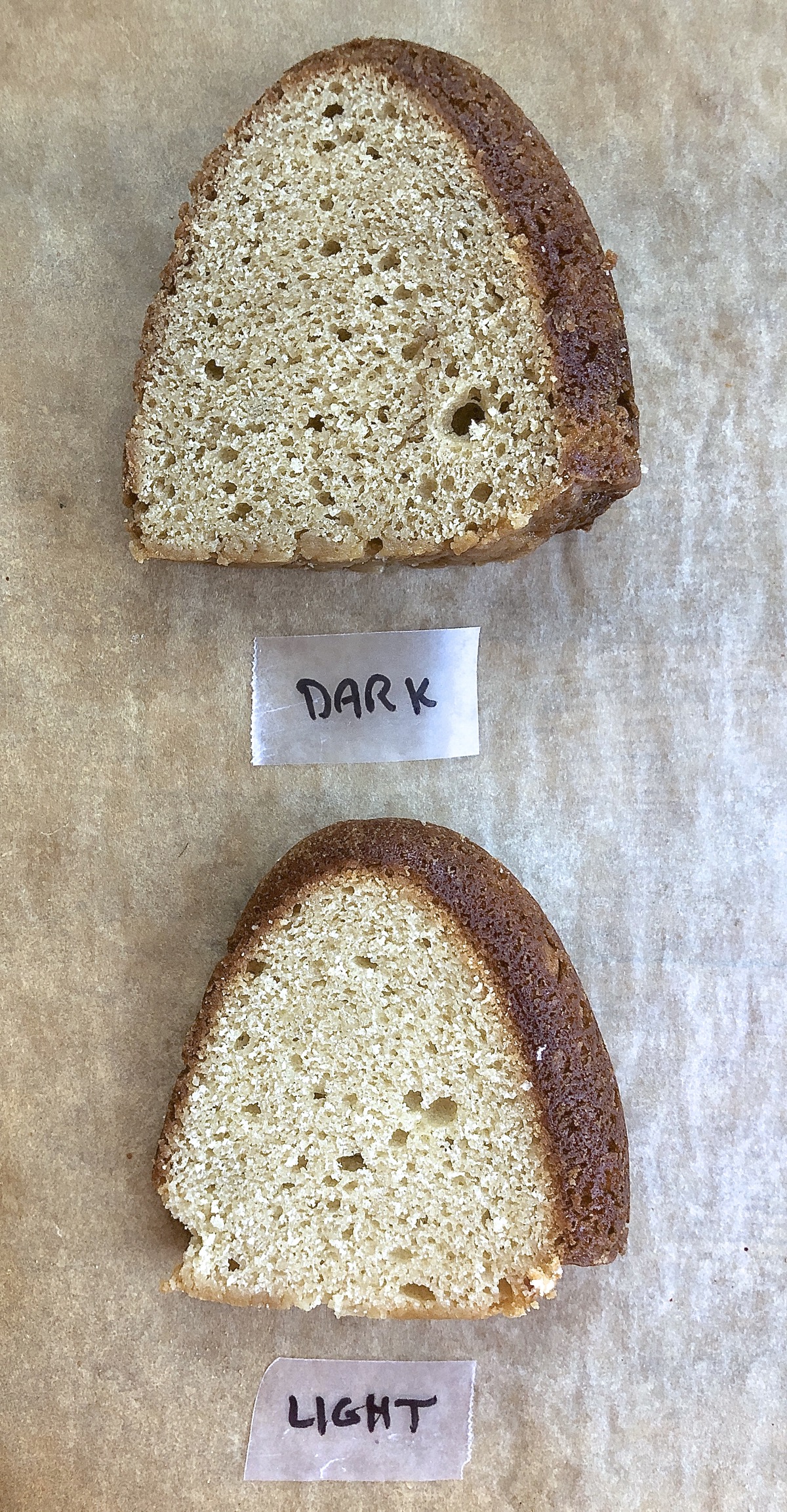 Two slices of pound cake, one made with light brown sugar, one with dark brown sugar.