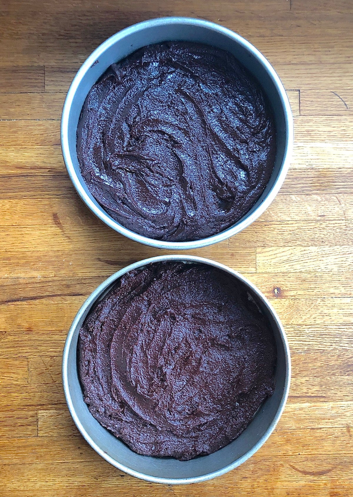 Two pans of brownie batter, one made with Truvia, one with granulated sugar