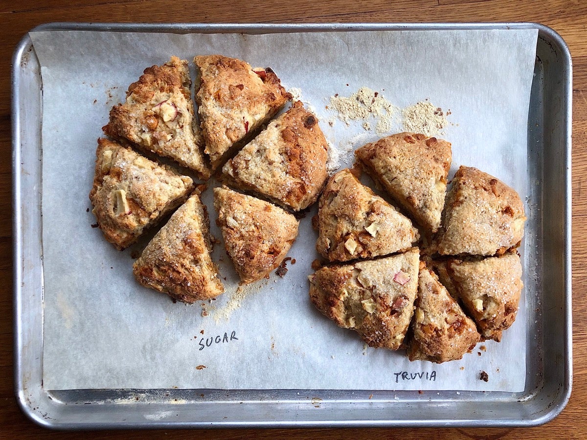 Baked scones on a baking sheet, half made with granulated sugar, half with Truvia Cane Sugar Blend