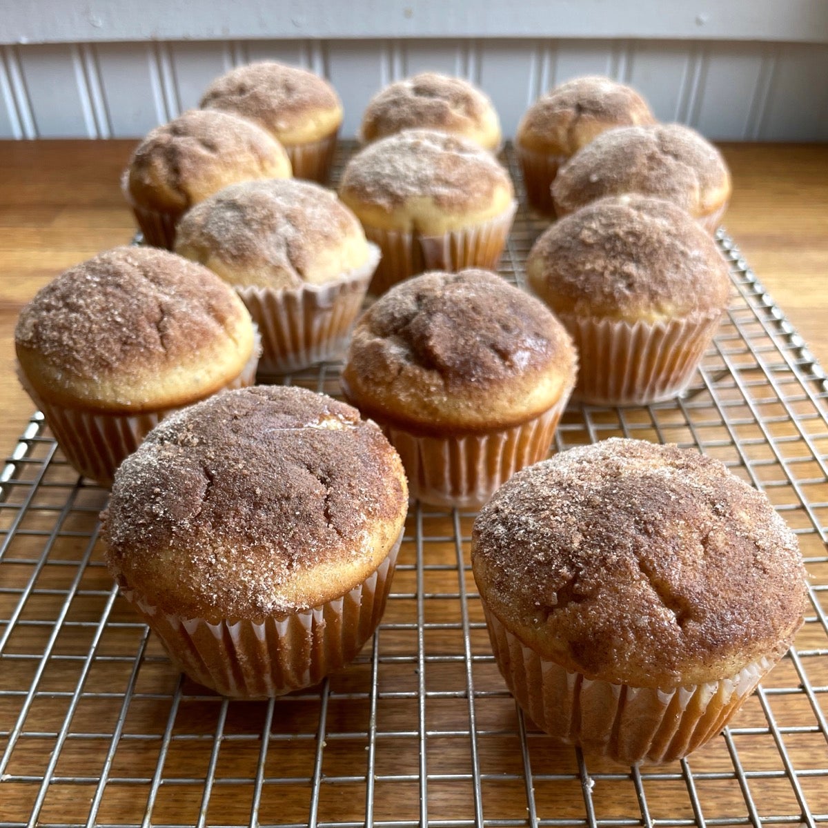 Doughnut Muffins on a cooling rack.