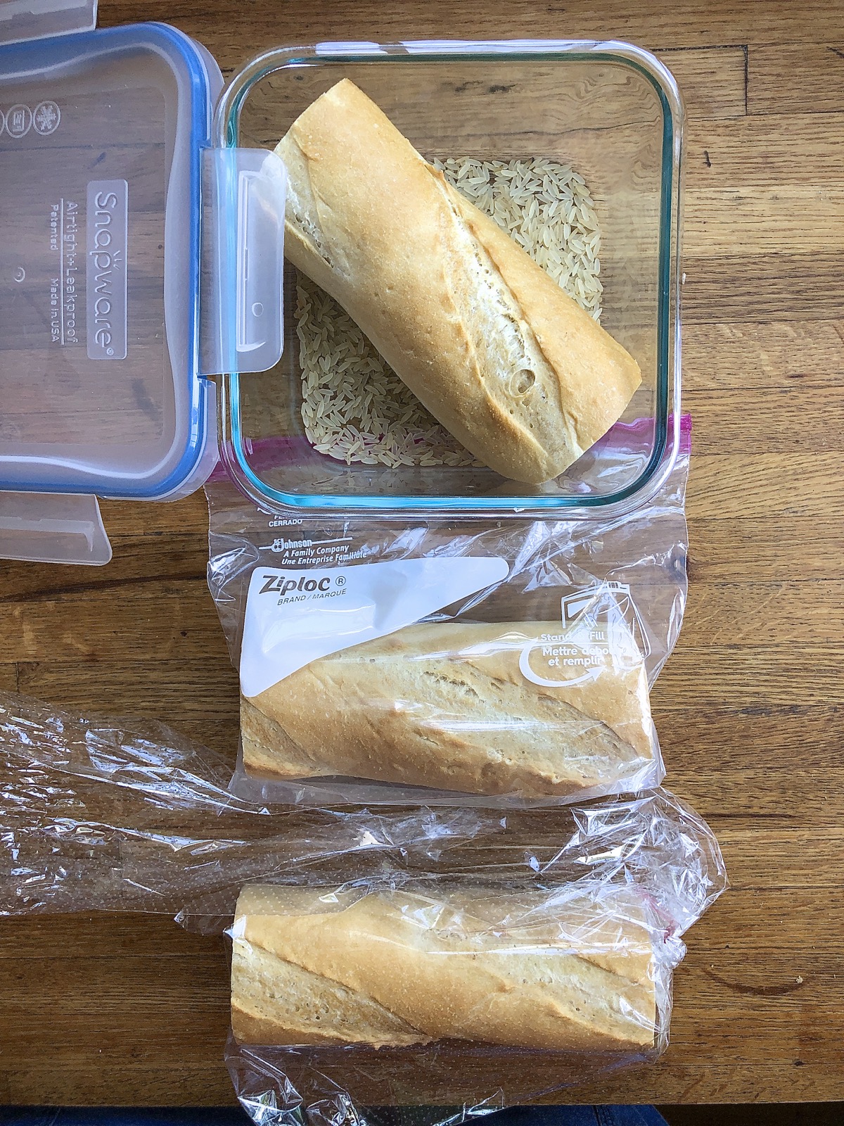 Baguette pieces stored three ways: in a perforated plastic bag, zip-top plastic bag, and glass container with dry rice.