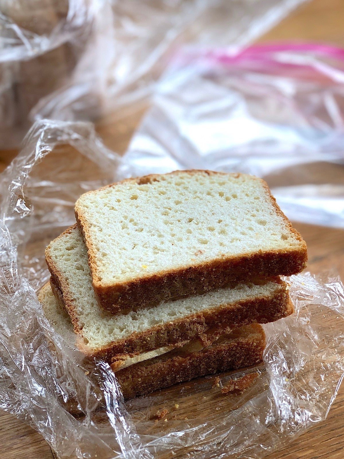 Packet of frozen bread slices unwrapped, ready to remove one for toasting.