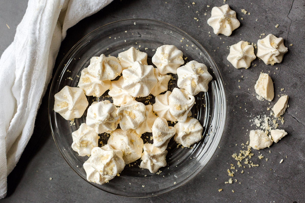 A plate of toasted sugar meringues sprinkled with more toasted sugar