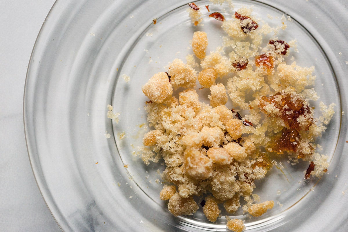 A plate of toasted sugar that's begun to melt and clump