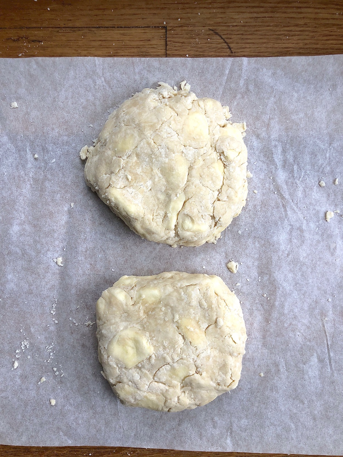 Two rough discs of pie crust dough