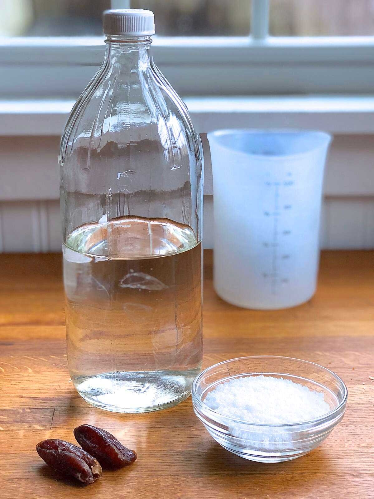 Ingredients for making a yeast water starter: dried figs, water, and sugar