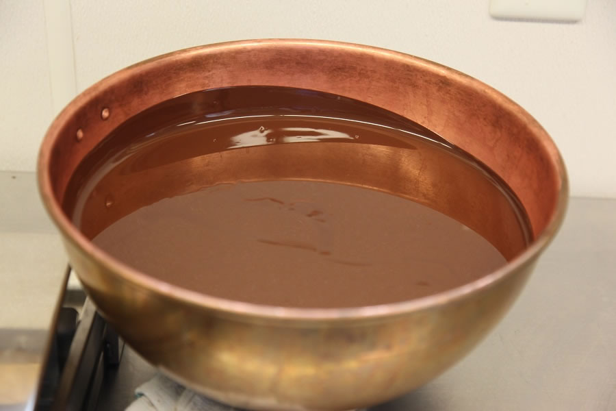 A bowl of perfectly smooth melted chocolate
