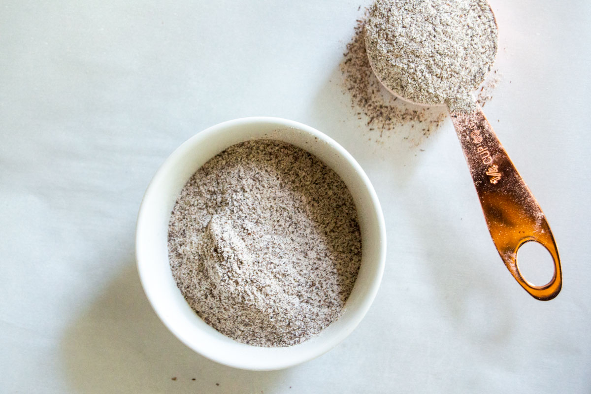 Buckwheat flour in bowl and measuring cup