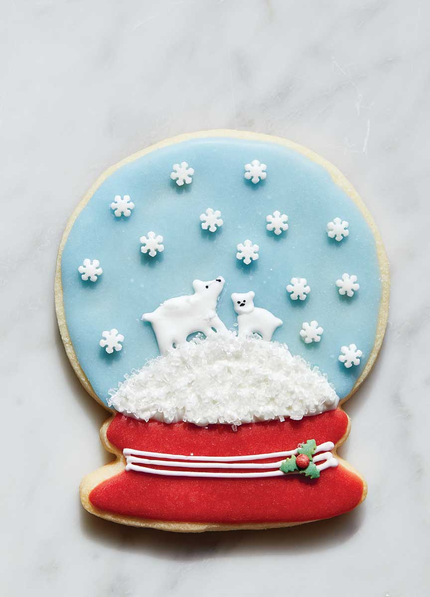 Sugar cookie decorated as a snow globe