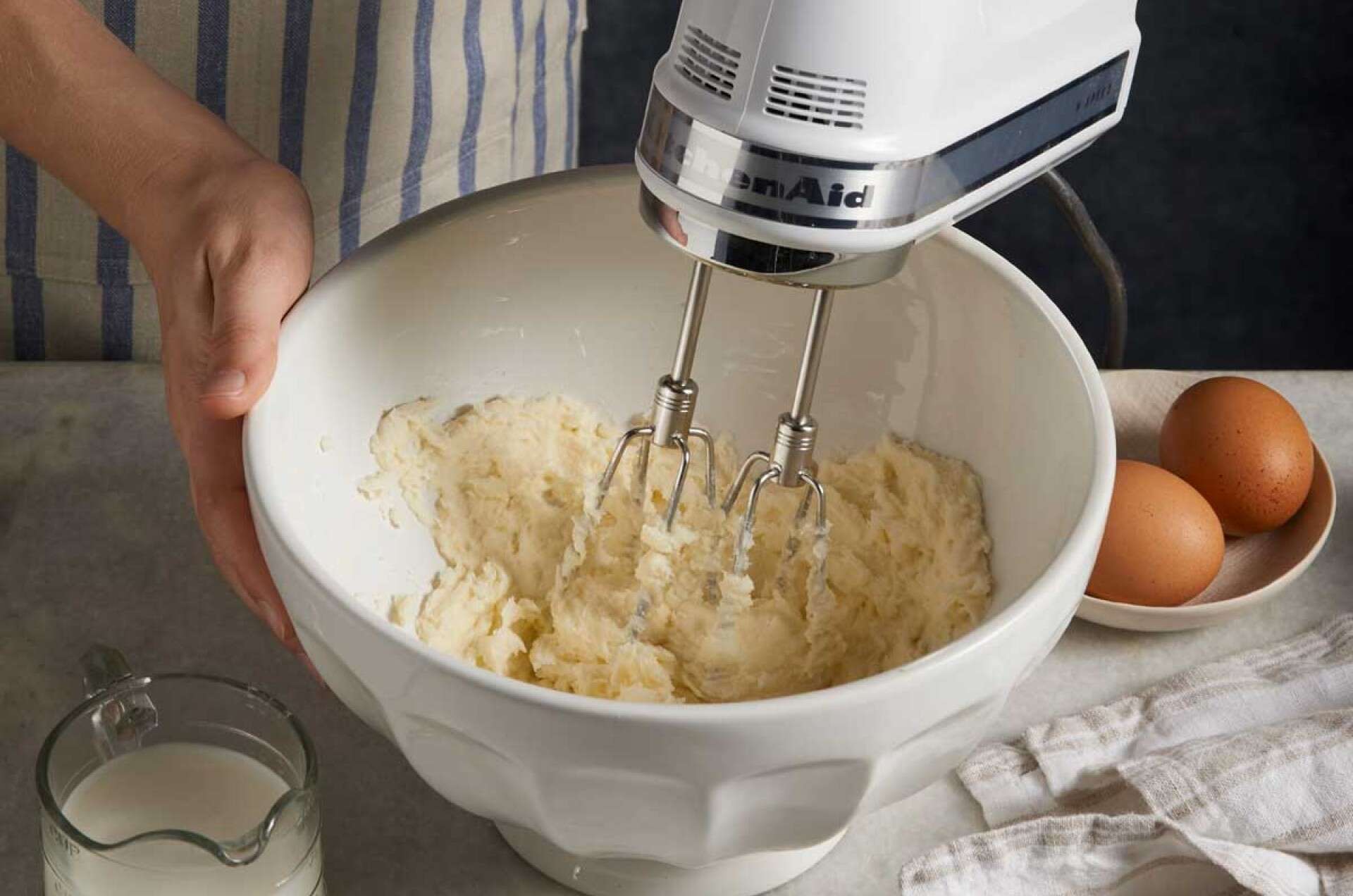 Beating butter and sugar with handheld mixer