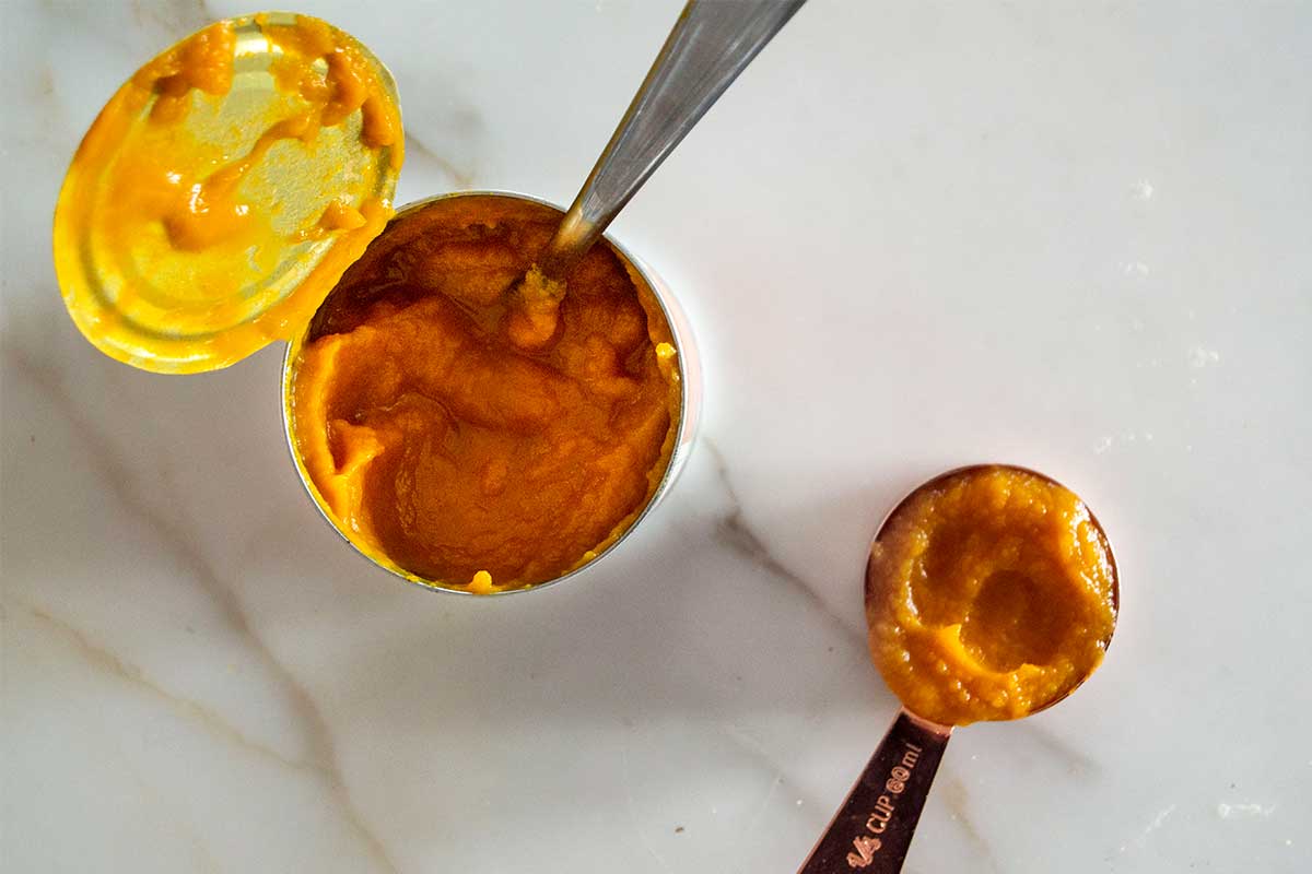 Pumpkin puree in measuring cup